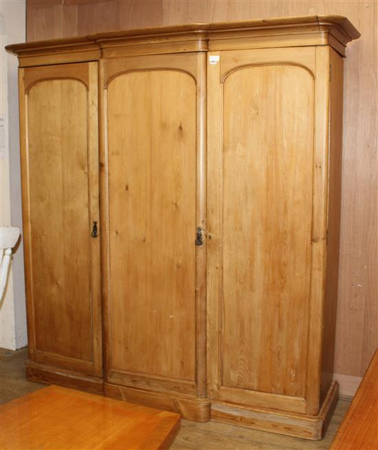 A late Victorian pine breakfront wardrobe, W.200cm D.74cm H.206cm